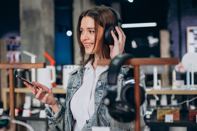 woman choosing earphones at store